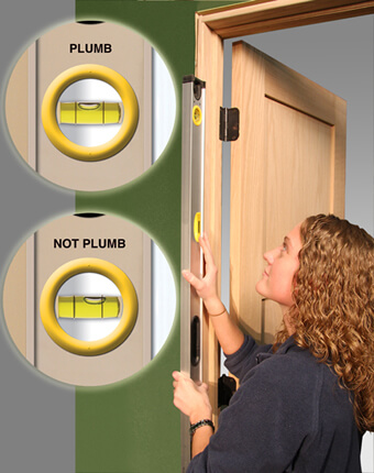 Checking door frame for plumb
