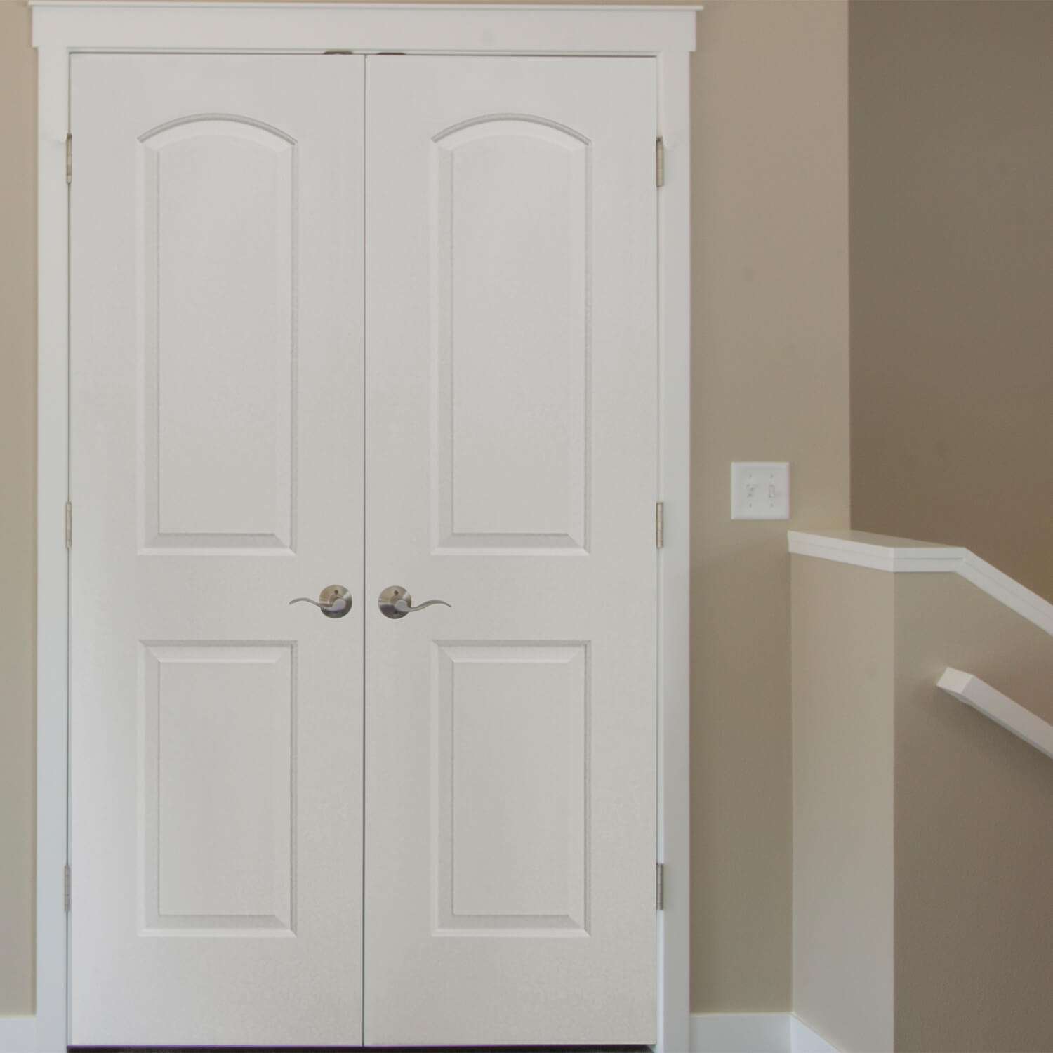 Primed 2-Panel Arch Raised Double Door Shown Painted White